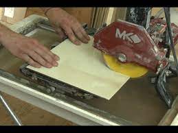 Switch on your tile saw. How To Cut Tile With A Wet Saw Youtube