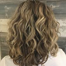 Highlights and dark lights are like elegant swirls. 30 Best Curly Hairstyles For Medium Hair Belletag