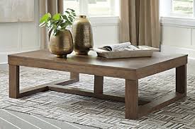 Solid wood coffee tables are a classic addition that never go out of style, and this option from ashley furniture is beautiful, spacious, and timeless. Cariton Coffee Table Ashley Furniture Homestore