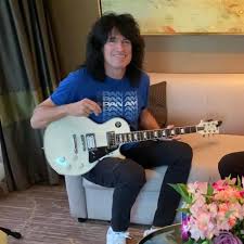 Happy Birthday to KISS guitarist Tommy Thayer. (Photos from two different  KISS Kruises… don't we miss them!)