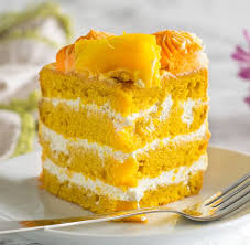 Learn How To Make A Eggless Mango Cake Mango Cake Recipe Without Butter And Eggs A Four Layered Cake With Eggless Pudd Mango Dessert Mango Cake Cake Recipes