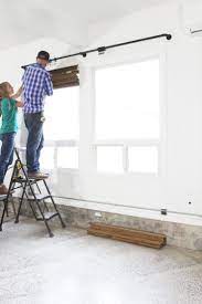 You can do a number of things to make your garage safer. Tacoma Converted Garage Window Treatments With Lowe S Our Favorite Option For Rentals The Grit And Polish Garage Windows Garage Doors Garage Door Maintenance