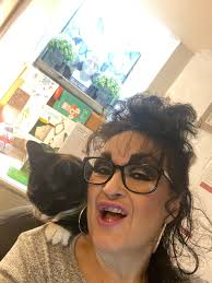 Erm, a bit tricky working at my desk in the Autism Consultancy Suite this  morning. 'Parrot Cat' Miss Jasmine is at it again! 😻😻😹😹