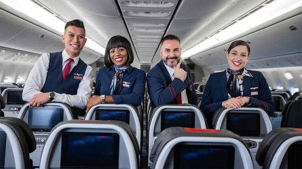 American Airlines cabin crew and passengers onboard aircraft.