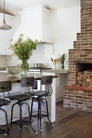 Adding a fireplace to the kitchen brings with it an air of luxury and style that is unparalleled. Red Brick Kitchen Fireplace Transitional Home Exterior