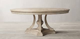 The expansion leaves are hidden in the body of the table. St James Round Dining Table Collection Rh