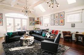 Vaulted ceiling in a bright and airy living room the huge chandelier in the center of this white living room with an arched window on the tall wall have both. Vaulted Ceiling Living Room Design Ideas