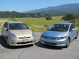 Toyota land cruiser prado off road on mud. 2012 Honda Civic Hybrid 2011 Toyota Prius