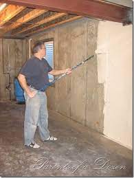 This is what this basement looked like when we started, grey and dingy. Parents Of A Dozen Painting An Unfinished Basement Unfinished Basement Basement Ceiling Unfinished Basement Walls