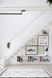 How Gallery Walls Are Like Cats And Why Your Home Probably Needs One Under Stairs Stair Wall Hallway Decorating