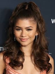 Her most famous hairstyles include the half up half down hairdo and the sleek bun. Celebrity Half Up High Ponytail Hair Trend Instyle
