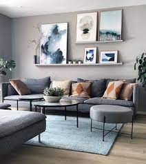 A large, empty living room wall can quickly turn into an eyesore, but a nuanced, artfully arranged one can upgrade the space as a whole. 20 Attractive Living Room Wall Decor Ideas To Copy Asap Simple Living Room Decor Living Room Design Modern Wall Decor Living Room