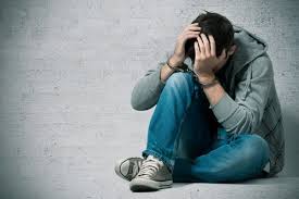 a handcuffed teenager