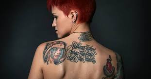 And, let's face it, she completely rocks them! Three Different Tattoos On Ruby Rose On The Back Of