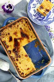 This cassava cake is coated with shredded coconut. Easy Cassava Cake Recipe Foxy Folksy