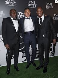 For biography starters, he bears the full names; Wilfried Mbappe Avec Son Fils Kylian Mbappe Et Tchaga Barber Coiffeur Les Celebrites Arrivent A La Ceremonie Des Trophees Fifa The Best 2019 A La Scala A Mi Purepeople
