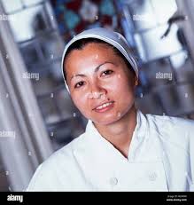 Kit Chan, chef, working with Anton Mossiman, archive photograph in  September 1990 for Taste magazine Stock Photo