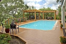 Pools With Wood Decks Large Composite Pool Deck With L Shaped Pergolas Composite And Vinyl Pool Shade Backyard Pool Pool Landscaping