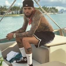 Few weeks ago, chris brown showed off a head tattoo , and now, the singer has added three more tattoos his legs. Chris Brown Singer Tumbex