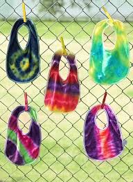 Throw A Tie Dye Onesie Party At Your Next Baby Shower Do Color Of Party Baby Shower Crafts Hippie Baby Shower Onesie Party