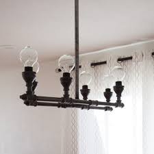 Here is another do it yourself custom diy steampunk lamp we built but this time using some really inexpensive plumbing pipe fittings. Diy Room Decor How To Make A Steel Pipe Chandelier Apartment Therapy
