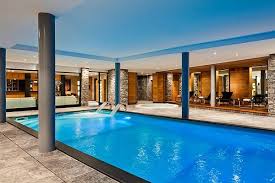A natural pool setting creates a oasis in the midst of a busy neighborhood. Refreshing And Large Indoor Swimming Pool Design Decoist Indoor Pool Design Indoor Swimming Pools Indoor Swimming