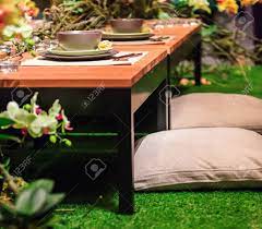Known as the ichiju sansai, a typical japanese meal at home involves one rice with several side dishes and a soup. A Japanese Style Dinner Table Setting In The Middle Of A Garden Stock Photo Picture And Royalty Free Image Image 15663540