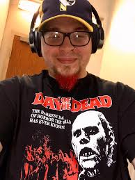 Sporting the group's own business shirt with horror graphics