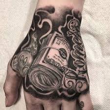 Money Hand Tattoos Best Money Tattoos Cool Money Bag Dollar Sign Cash Stack And Monopoly Man Money Ta Hand Tattoos For Guys Hand Tattoos Tattoos For Guys