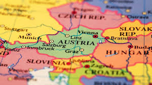 Mapa mundial de la bandera de austria en el pin con el nombre del país sobre fondo gris. Las 8 Ciudades Mas Bonitas De Austria