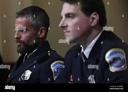 L-R) DC Metropolitan Police Department officer Michael Fanone and DC  Metropolitan Police Department officer Daniel Hodges look
