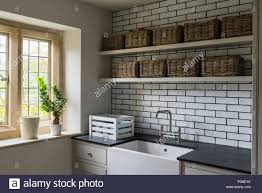 wicker baskets on shelving above butler