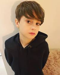 Charley Webb shows off nine year old son Buster's new look after having  hair cut short