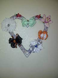 I Re Did The Bow Wreath I Bought A Heart Wreath From Hobby Lobby Spray Painted It Purple And Wrapped Ribbons Around It Pret Baby Crafts Wreath Bow Crafts