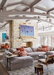 This living room from jojotastic has several boho farmhouse style elements going for it, including the hanging house plants and bright geometric rug. Tour This Ranch Style Home With A Playful Bohemian Vibe On Lake Austin