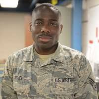 Traditional guardsman Senior Airman Yannick Adjei working