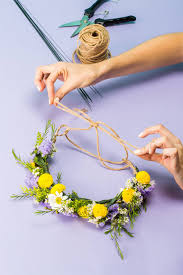 Trim about an inch off the bottom of each flower then put them in a vase of water for at least an hour, adding flower food if they came with it. How To Make A Flower Crown