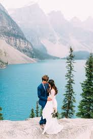 Boho Bride And Groom Embrace Overlooking Moraine Lake During Their Banff Alberta Wedding Portland Oregon Wedding Yosemite Wedding Elopement