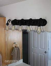 For a complete update, replace the sink, countertop and faucet the same time as the vanity cabinet. Bathroom Light Fixture Makeover Sawdust Sisters
