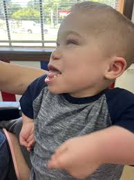 Fresh haircut this past week, playing in boxes and sleepovers at Memaw and  Big Daddy's