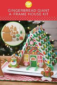 Prepare This Impressive Gingerbread House Display Complete With Gingerbread Cookie Extras Christmas Gingerbread House Gingerbread House Kits Gingerbread House
