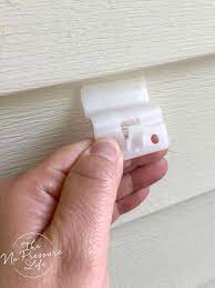 How To Hang Things On Vinyl Siding Without Damaging Your Home Vinyl Siding Vinyl Siding Hooks Porch Wall Decor
