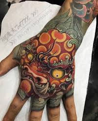 There are many artists who specialize in japanese tattoos, so it's not that hard to find one around the world. Pin By Roeland Lubbers On Foo Dog Ink Japanese Hand Tattoos Hand Tattoos Tiger Hand Tattoo