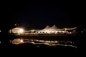 Outdoor Cafe Lighting Draped Over A 200 Long Dinner Table Lighting Support Poles Are Mad Kentucky Wedding Venues Outdoor Tent Party Outdoor Wedding Lighting