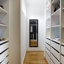 The usage of dark color contrasts with the primary color of the background creates a simple yet elegant look, which adds more masculinity to the whole design of the closet. Custom Walk In Closet Designs In Hunterdon County Nj Closet Possible