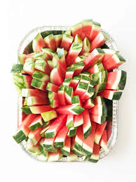 How to slice and serve watermelon for easy there's so many techniques on how to cut a watermelon. How To Cut A Watermelon For A Crowd The Skinny Fork