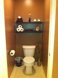 These tips on how to decorate a small downstairs toilet will really help your room look bigger and less cluttered! Toilet Room Ideas Toilet Room Toilet Room Decor Small Bathroom Makeover