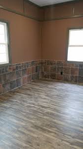 Rustic Man Cave Conversion From A Garage Flooring Is A Floating Style Heavy Duty Lvt Luxury Vinyl Tile Plank Walls Garage Floor Flooring Luxury Vinyl Tile