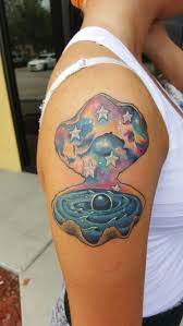 A Swirling Ocean Galaxy Black Hole Pearl And Star Fish Stars All Inside A Clam Shell Mermaid Tattoo Clam Tattoo Pearl Finger Tattoos