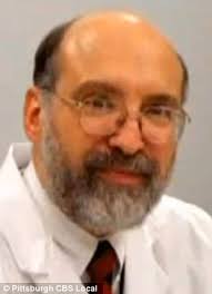 Prominent university professor and his wife found murdered in their  home...as police investigate possible links to another double homicide in  the town five years ago